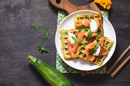 Belgian waffles with zucchini and greens with cottage cheese and salted salmon.の写真素材