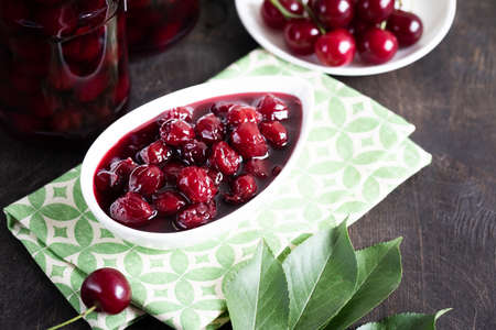 cherry jam and fresh cherries in a bowl, homemade preservesの写真素材