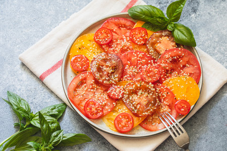 tomato salad with hemp seeds. healthy food concept with superfoodsの写真素材