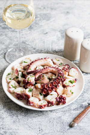 boiled chopped octopus on a concrete table.の写真素材