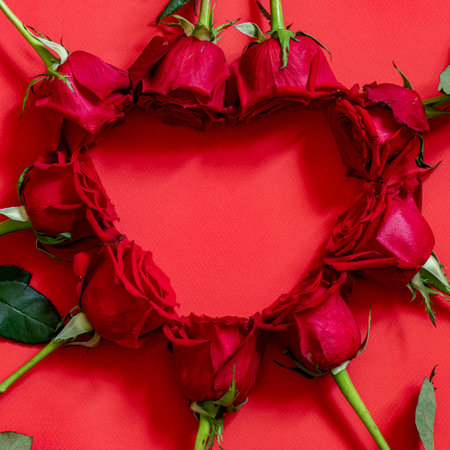 valentine day background with red hearts and roses, top view.の写真素材