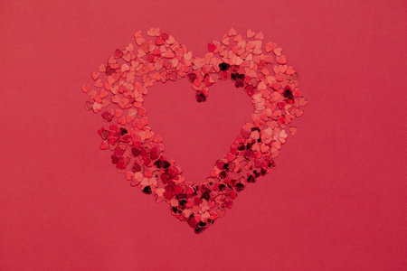 Valentine day background with red hearts on red background, top viewの写真素材