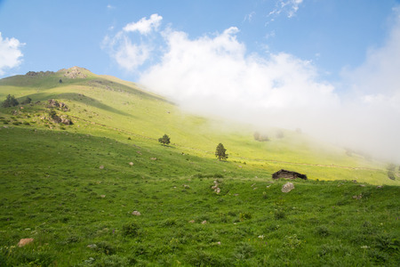 mountain green hills to the rivers and the blue skyの写真素材