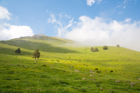 mountain green hills to the rivers and the blue skyの写真素材