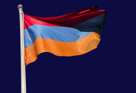 The national flag of Armenia, the Armenian Tricolour, against a clear dark blue skyの写真素材