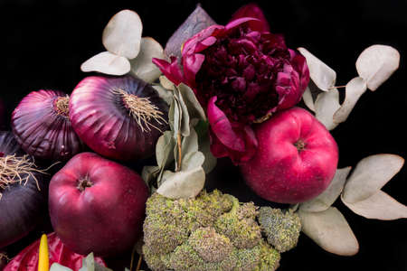 Vegetables, flowers and apples autumn background. Beautiful pattern of vegetarian food. Harvest festival still life.の写真素材