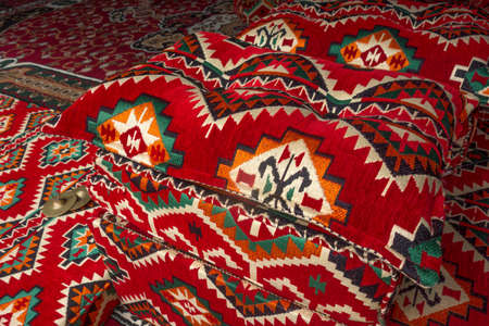 Unique arabic carpets and pillows. The interior of the premises in Qatar. Vintage traditional oriental patterns.の写真素材
