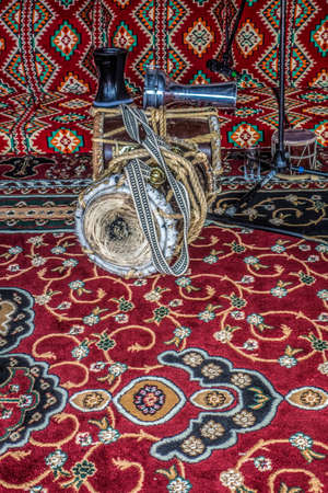 Arabic musical instruments, vintage drums, darbuks, flutes on the background of vintage carpets.の写真素材