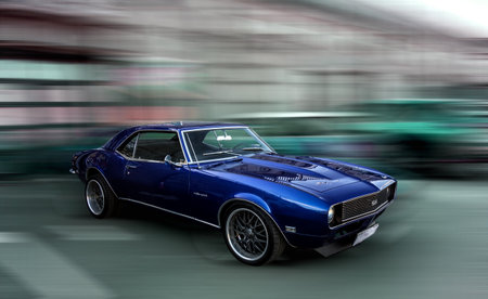 Brand vintage blue sports American car Chevrolet Camaro with classic retro styling. Blurred background with a shadow detail drawn in under the car. 1968 Chevy Camaro RS/SSのeditorial素材