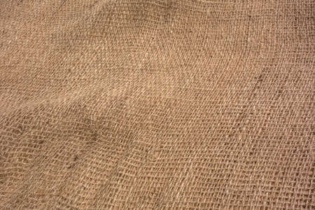 Jute fiber coarse mesh texture abstract background. Burlap jute canvas vintage background. Texture burlap, linen fabric with large mesh.の写真素材