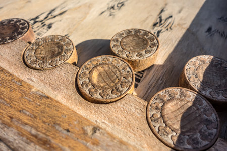 Old wooden backgammon. Backgammon chips close-up on the board. An ancient board game from the Middle East. Plenty of space for your textの写真素材