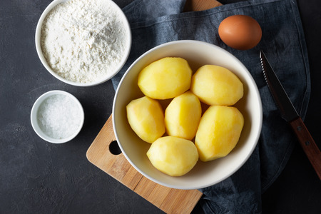 Ingredients for cooking Italian cuisine gnocchi - boiled potatoes, flour, egg and salt.の写真素材