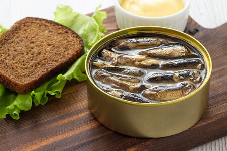 Canned sprats in tin can with bread for sandwichの写真素材