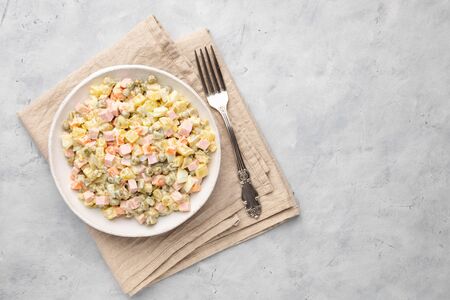 Russian salad Olivier with mayonnaise on plate. Above view. Copy space for text.の写真素材