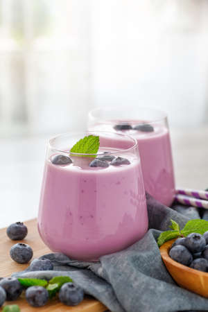 Vegan smoothie with fresh blueberries in glass jar. Healthy food.の写真素材