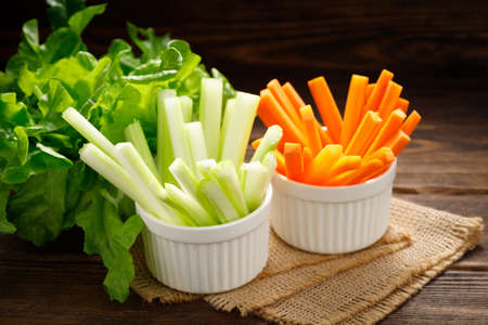 Fresh vegetables - chopped celery sticks and carrots. Diet and healthy food.の写真素材