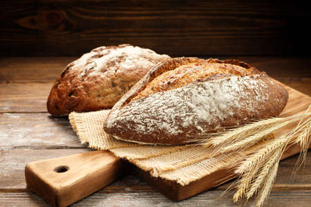 Freshly baked traditional bread on a wooden table.