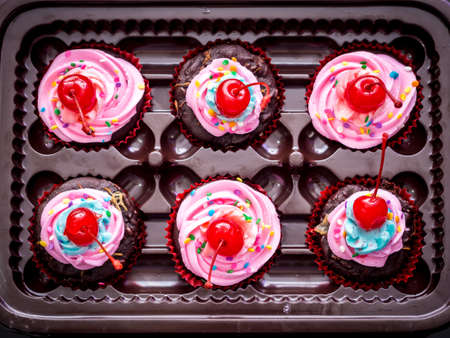 Blue-Purple Vegan Cupcakes with Cherry on Topの写真素材