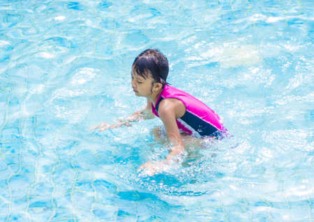 Asian Kid (Girl) in Swimming Poolの写真素材