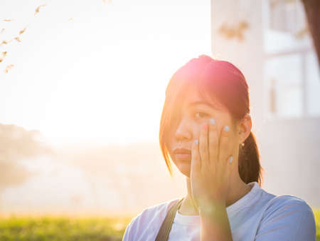 Beautiful Young Asian - Chinese Woman Holding Cheek, Have A Toothaceの写真素材