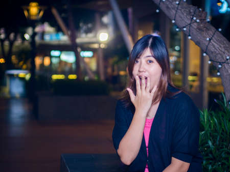 Beautiful Young Asian - Chinese Woman Surprised, Hand on Mouthの写真素材