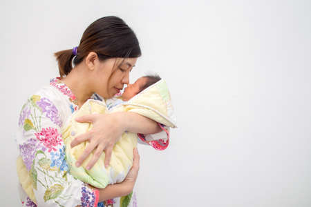 Mother Carrying Her Babyの写真素材