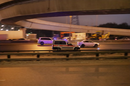 Ambulance car on the highway at night.の写真素材