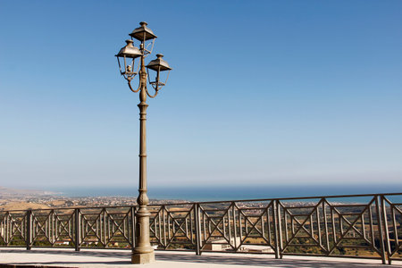 Lamppost on the background of the sea and the skyの写真素材