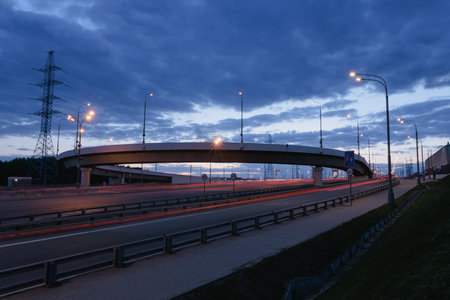 Traffic on the bridge at sunset in the evening, Moscow, Russia