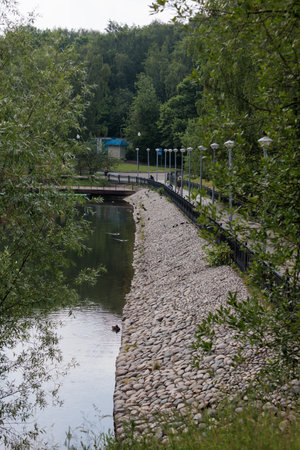 river and bridge in the park on a cloudy summer day, nature seriesの写真素材