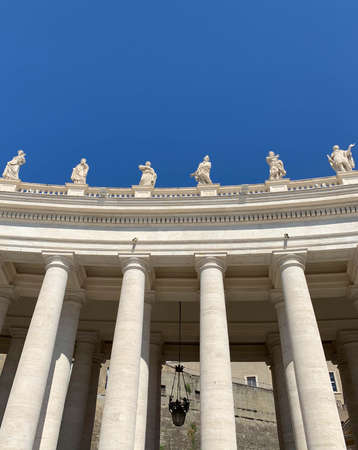 Columns and Michelangelo's sculptures at Square of St. Peter's Basilica in Vatican, Rome, Italyのeditorial素材