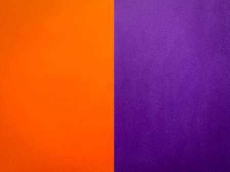 Background half orange, half purple with copy space for textの写真素材