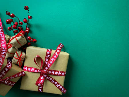 Flat lay concept. Christmas presents laid on a green  background. Copy space.の写真素材