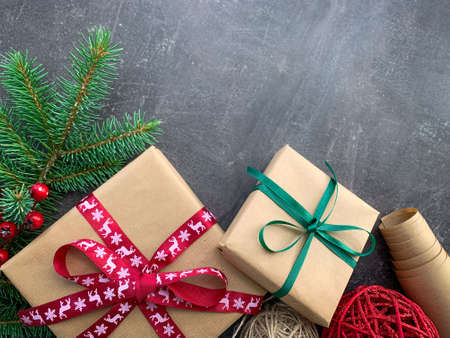 Beautiful Christmas gift boxes with decor on wooden background.の写真素材