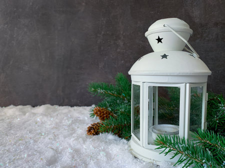 Beautiful holiday decorated background with white lantern and fir. Christmas holiday concept.の写真素材