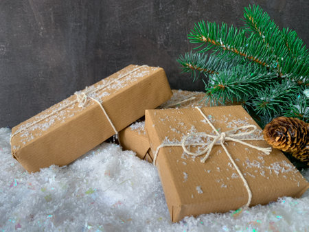 Christmas sustainable gift boxes with fir tree branch. Christmas zero wasteの写真素材