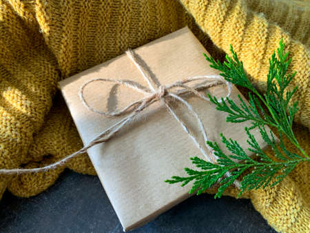 Handmade Christmas gift and warm sweater. Winter mood. Happy holidays concept.の写真素材