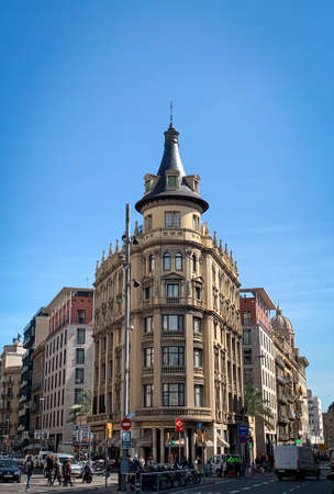 Barcelona, Spain, 10 March 2020 - Building at the corner of Ronda de la Universitat. City life on the street next to The PlaÃ§a de la Universitat.のeditorial素材