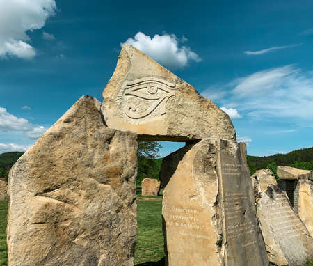 The Eye of Ra symbol engraved on stone block in Bulgarian Stonehenge. Modern stone cromlech in village of Rayuvtsi, Bulgaria.の写真素材