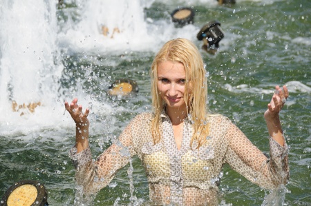 young women in the fountainの写真素材