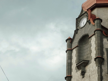 Old architecture  building clock shows time passed by