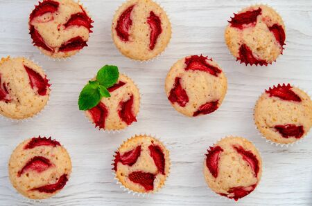 Strawberry muffins, close white background with mintの写真素材