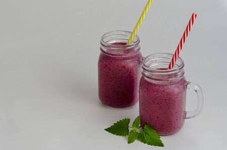 bilberry or blueberry smoothie in jar isolated on white background.の写真素材