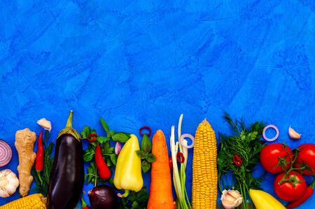 food background photo of different vegetables on blue backgroundの写真素材