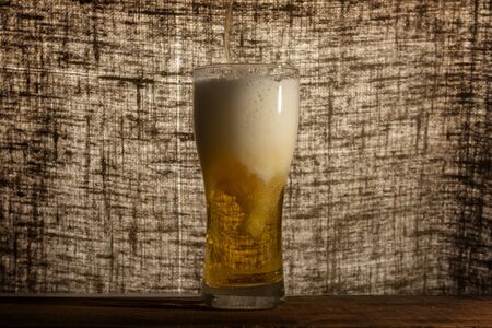 Glass beer on dark background with copyspaceの写真素材