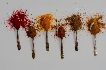 Various spices in spoons isolated on whiteの写真素材