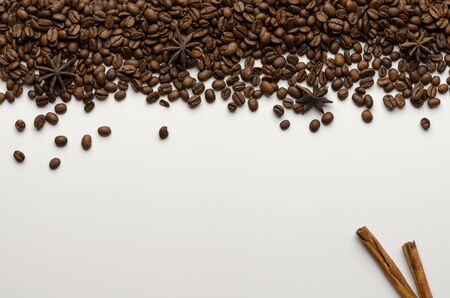 Coffee beans with anise and cinnamon isolated on whiteの写真素材