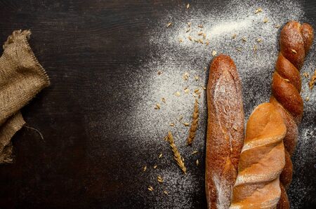Bread on a rustic wooden background, close-up, top view