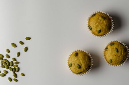 pumpkin delicious muffins on the white background.の写真素材