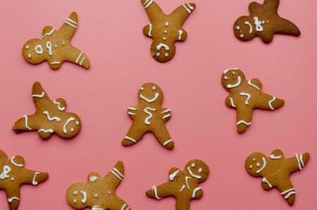 Christmas gingerbread cookies on pink background.の写真素材